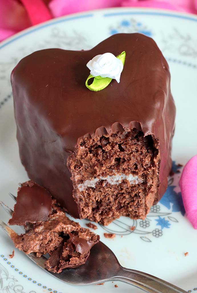 Heart Shaped Chocolate Cakes with a tender raspberry cream are the perfect dessert for Valentine’s Day or date night! #chocolate #valentine #raspberry