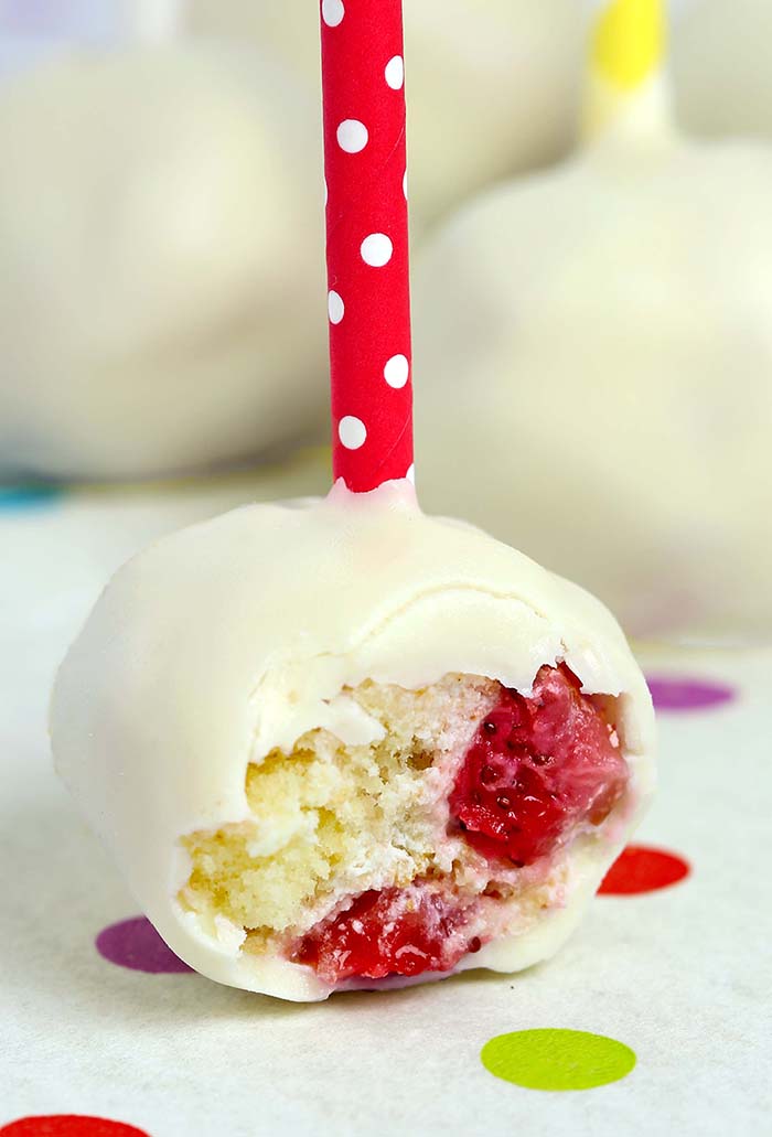 Strawberry shortcake pops - Angel food cake balls stuffed with fresh strawberries and whipped cream then dipped into melted white chocolate.  A simple and fun way to enjoy the classic strawberry shortcake.