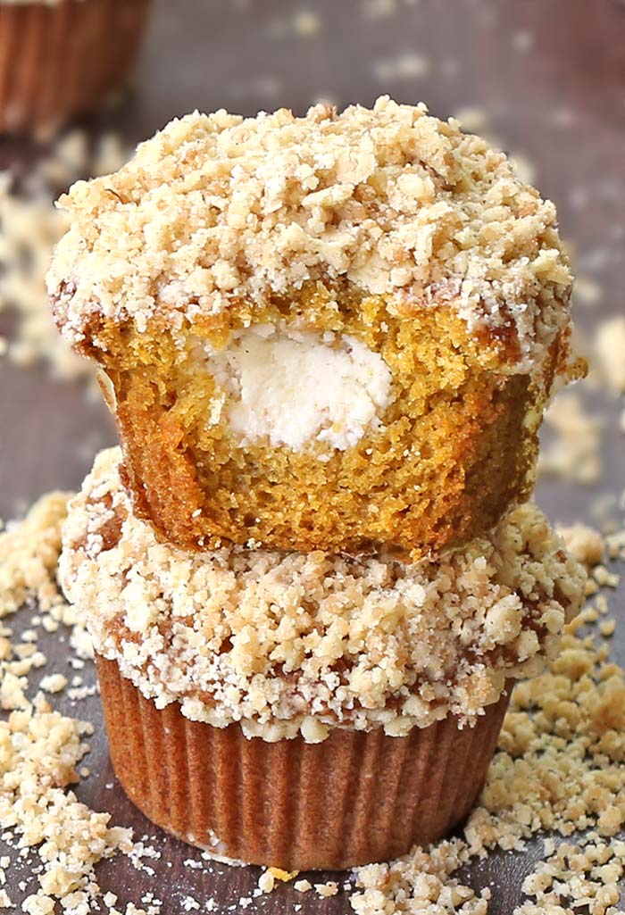 Delicious pumpkin muffins filled with cream cheese and topped with a cinnamon streusel. 