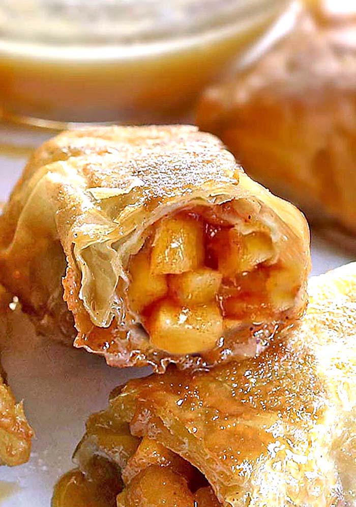 Easy Apple Pie Egg Rolls!! a quick and easy dessert egg rolls filled with warm homemade apple pie filling and served with a caramel dipping sauce. 