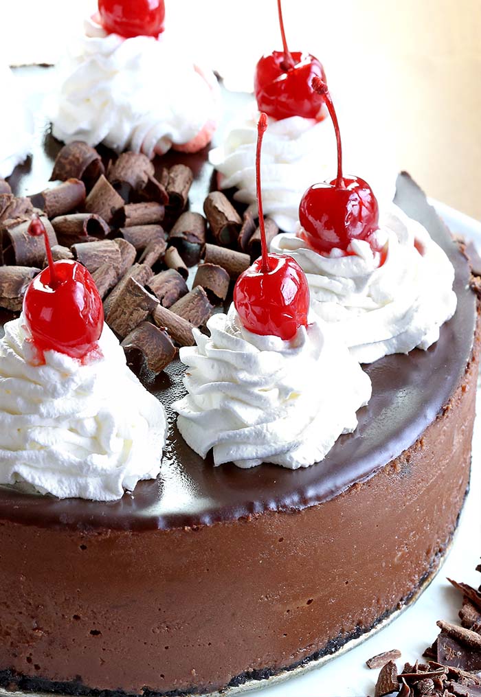 Smooth, rich, decadent, chocolatey CHOCOLATE! Triple Chocolate Cheesecake with whipped cream and cherries, is simply a dream come true for any chocolate lover….like me!