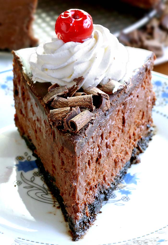 Smooth, rich, decadent, chocolatey CHOCOLATE! Triple Chocolate Cheesecake with whipped cream and cherries, is simply a dream come true for any chocolate lover….like me!