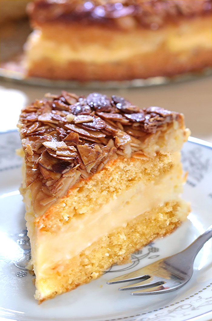 Bee Sting Cake - Crunchy, honey-flavored almond topping, creamy filling, and two delicious yeast cake layers make this traditional German dessert absolutely wunderbar!