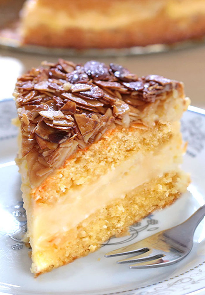 Bee Sting Cake - Crunchy, honey-flavored almond topping, creamy filling, and two delicious yeast cake layers make this traditional German dessert absolutely wunderbar!