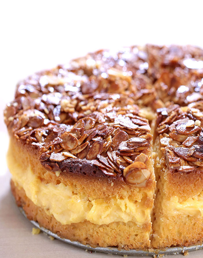 Bee Sting Cake - Crunchy, honey-flavored almond topping, creamy filling, and two delicious yeast cake layers make this traditional German dessert absolutely wunderbar!