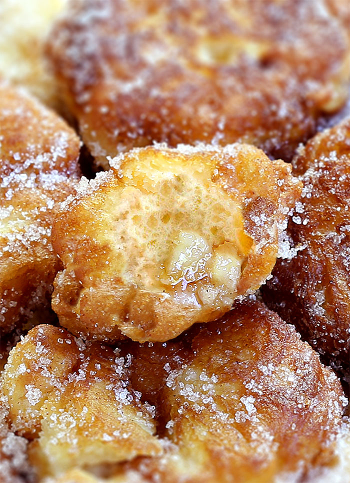 Apple Fritters - deep fried homemade dessert filled with apples, cinnamon and coated in cinnamon sugar or covered with sweet glaze...you just can’t get enough of them!