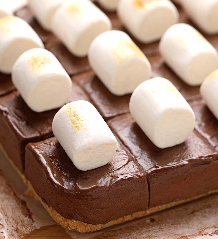 These Hot Chocolate Pie Bars are too good to be true. Decadent dessert made with graham crackers crust, luscious chocolate filling and toasted marshmallows.