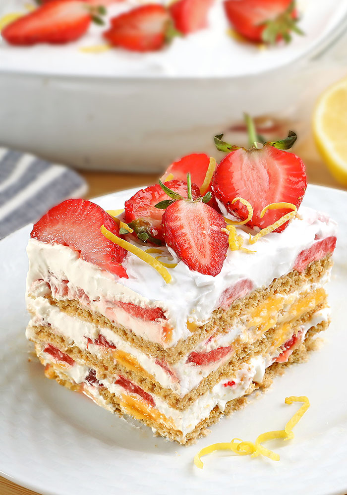You will not believe how simple and delicious this Strawberry Lemonade Icebox Cake is! Layer the heavy cream and strawberries over crackers and lemon curd, this dessert can be made in a flash! It’s the perfect summer dessert or anytime of the year!