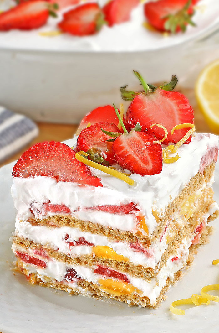 You will not believe how simple and delicious this Strawberry Lemonade Icebox Cake is! Layer the heavy cream and strawberries over crackers and lemon curd, this dessert can be made in a flash! It’s the perfect summer dessert or anytime of the year!