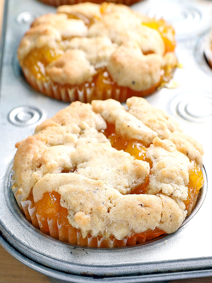 Peach Cobbler Mini Cheesecakes nothing beats warm juicy peaches wrapped in spices, layered in creamy cheese, and baked under a buttery flaky biscuit top. It is what summer dreams are made of.