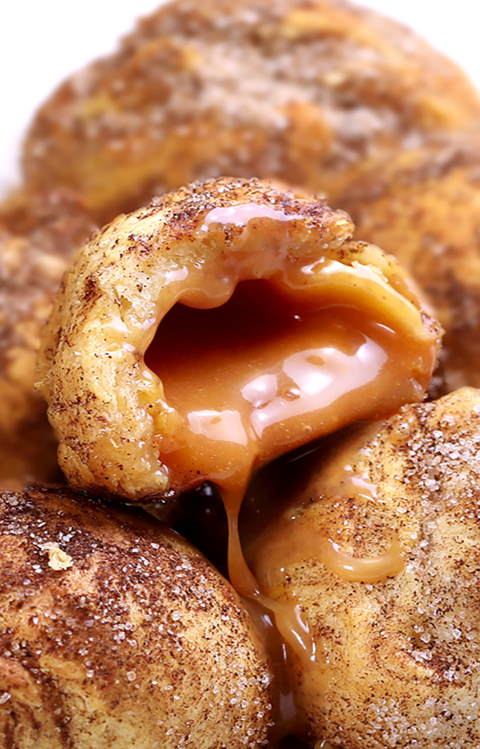 3-ingredient Caramel Snickerdoodle Bombs is a quick and easy recipe full of gooey caramel filling. Perfect to serve at your next Fall party.