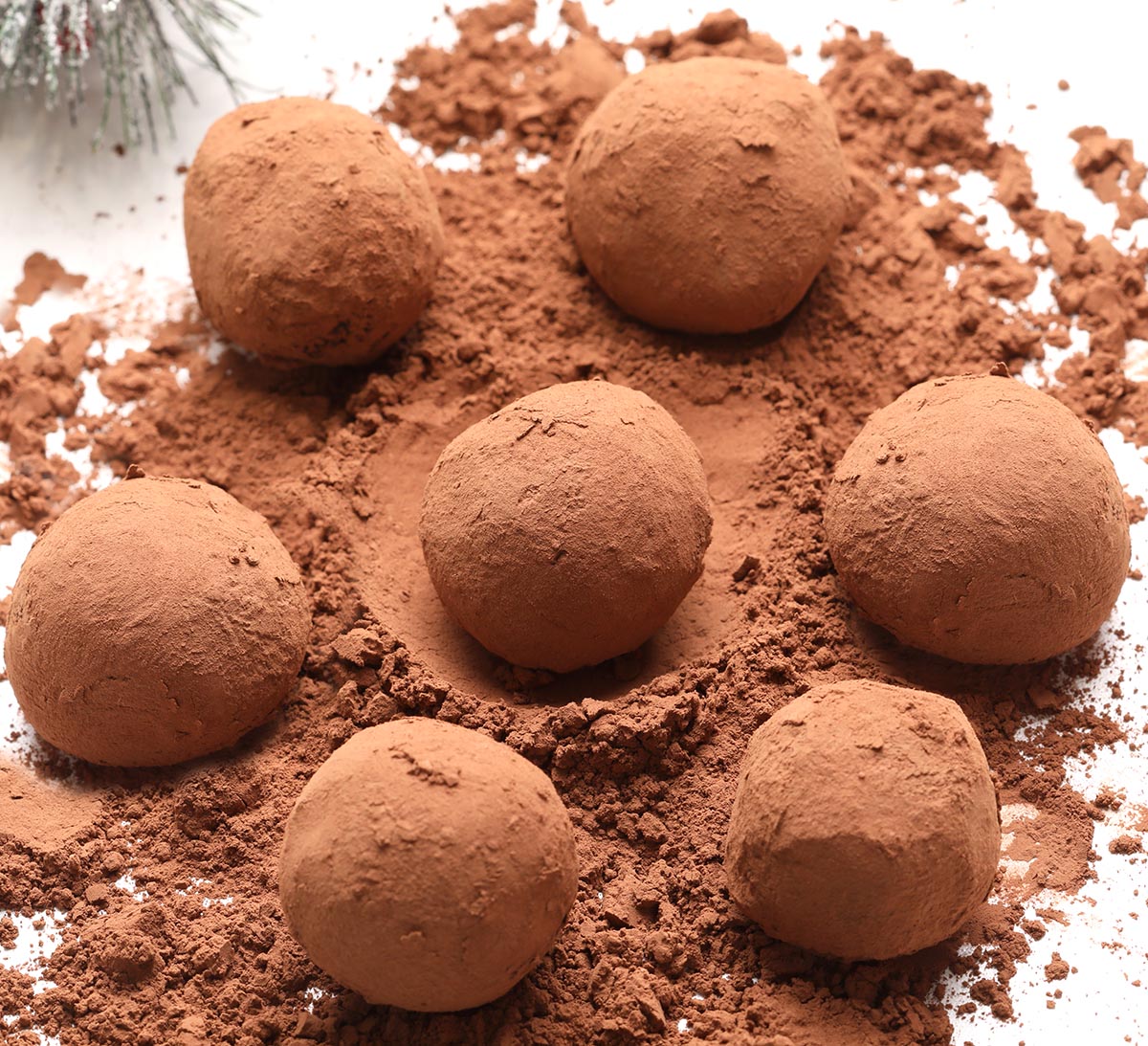 These Mexican Hot Chocolate Balls made with bittersweet chocolate, cinnamon, nutmeg and a hint of cayenne pepper or chili will warm you up this winter! Perfect for Christmas, Valentine’s Day....or a random winter day.