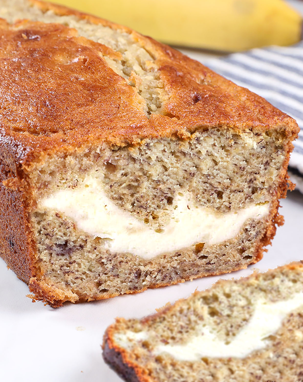 Cream Cheese Banana Bread - light, moist and delicious! This is the BEST homemade banana bread recipe! Perfect for breakfast, snacks, and dessert!
