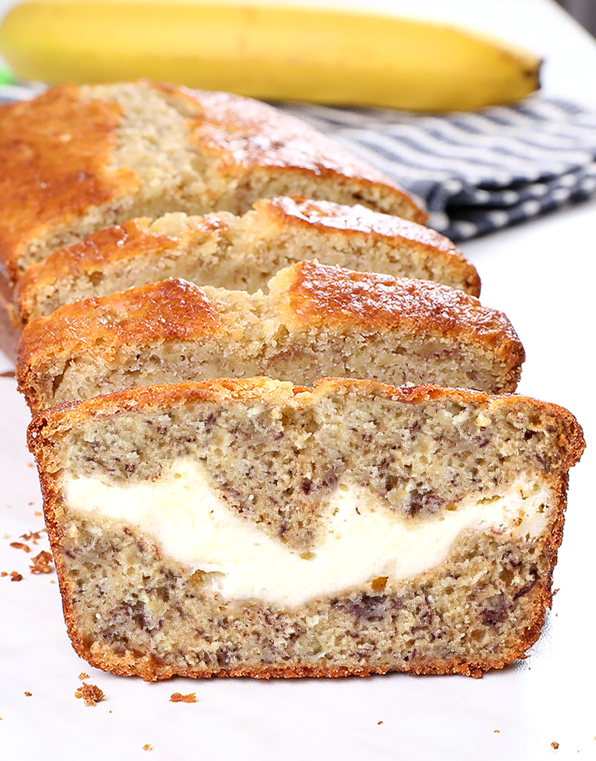 Cream Cheese Banana Bread - light, moist and delicious! This is the BEST homemade banana bread recipe! Perfect for breakfast, snacks, and dessert!