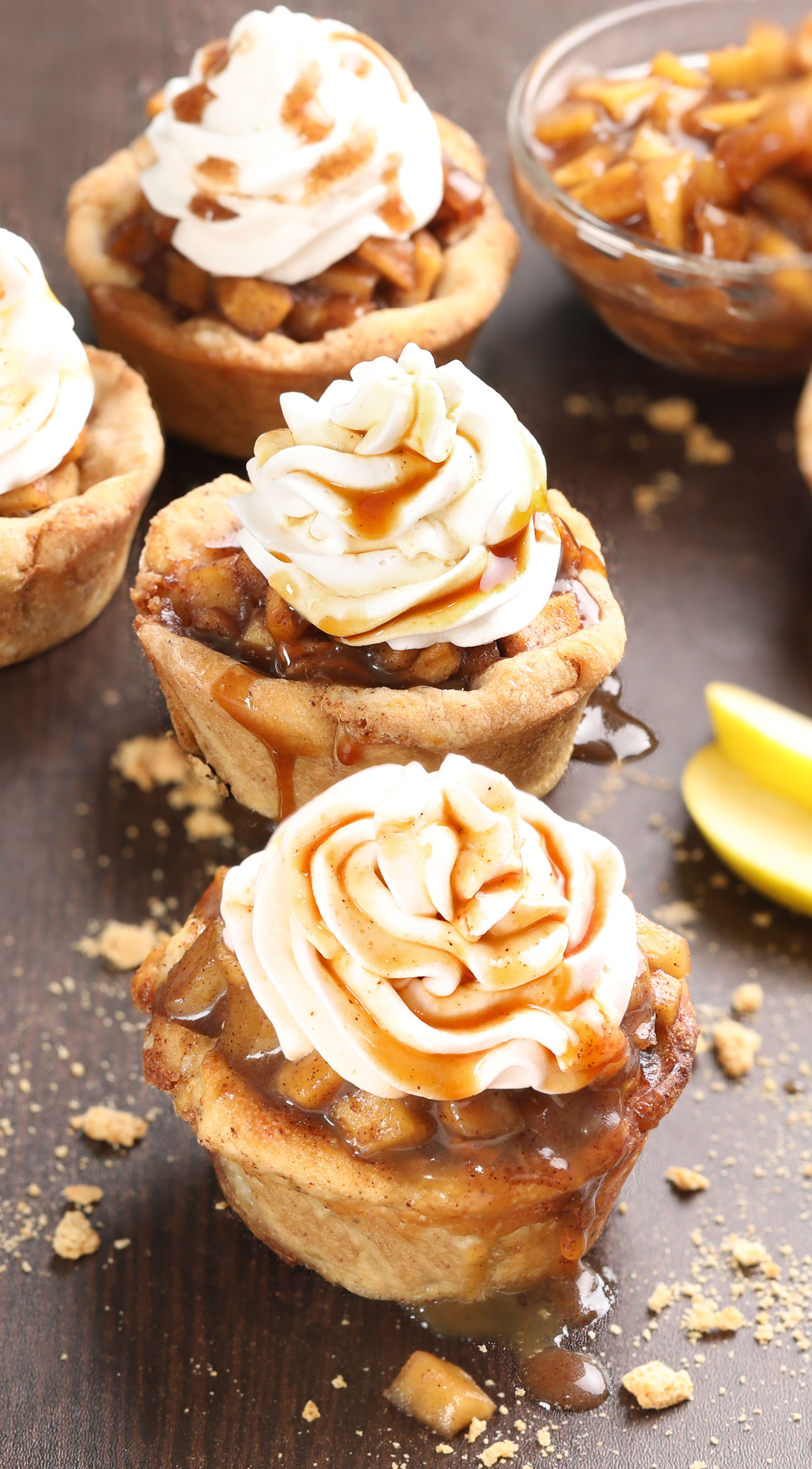 Apple Pie Bites - Bite-size cinnamon roll cups that are filled with warm spiced apple pie filling and crumbly topping. The ultimate fall dessert!
