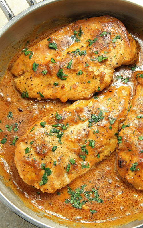 Skillet Chicken in Onion Sauce - Crispy, golden chicken on the outside and tender on the inside in balsamic caramelized onion cream sauce is a winner of a chicken dinner!