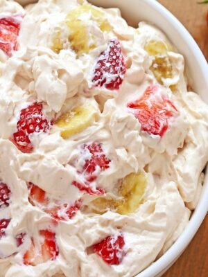  Strawberry Cheesecake Salad - or what I like to call a “potluck salad.” Rich and creamy cheesecake filling is folded into your favorite berries to create the most amazing fruit salad ever! 